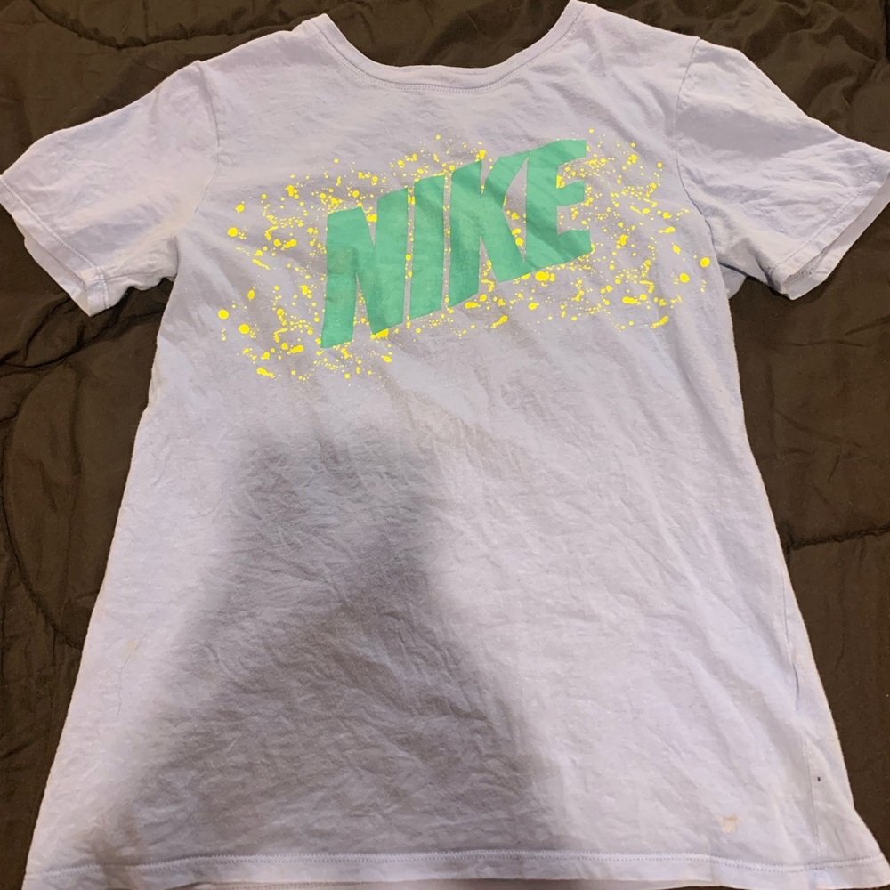 Blue nike shirt. Very comfortable and breathable. Newer. Blue, teal, and yellow.
